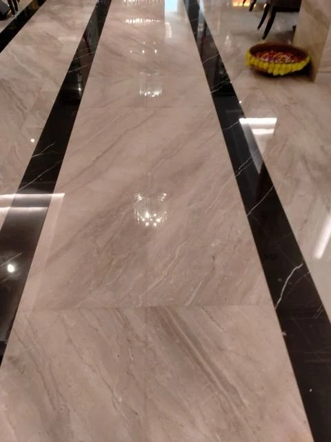 Professionally polished marble floor with dark inlay
